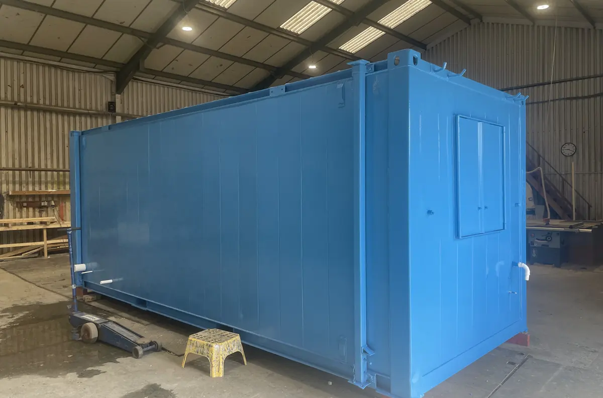 Portable cabin being refurbished with new cladding and flooring in a workshop